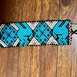 Beaded style white blue, and move and black bracelet.